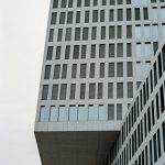 a very tall building with a clock on it's side