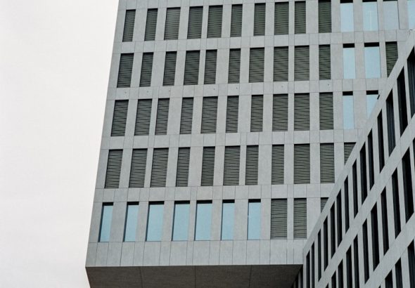a very tall building with a clock on it's side