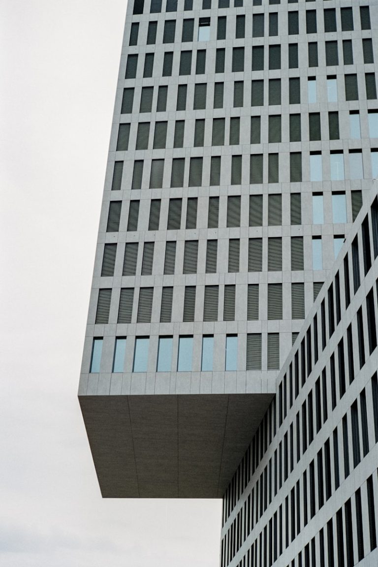 a very tall building with a clock on it's side